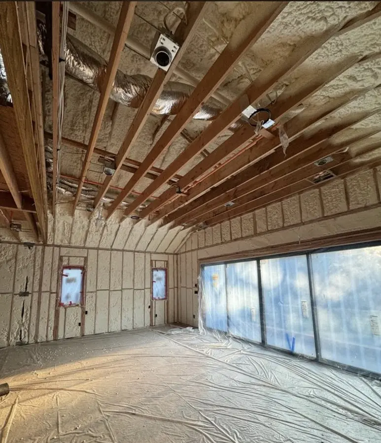 Interior walls and ceiling insulated with spray foam during new construction in Longboat Key